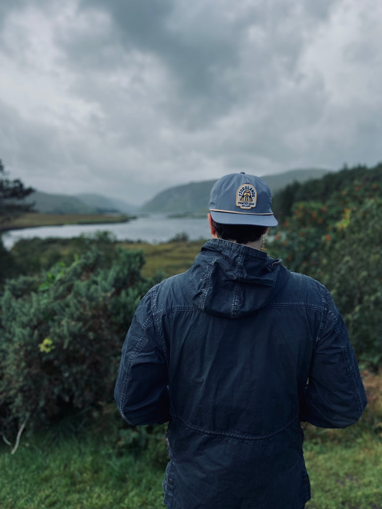 Man wearing the Fjordlands Walrus Hat in Ireland looking out in the distance