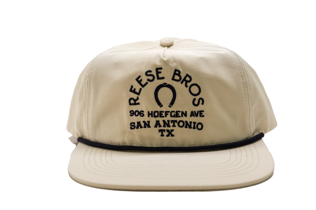 Reese Bros x Fjordlands snapback hat in cream color way from the front view. 